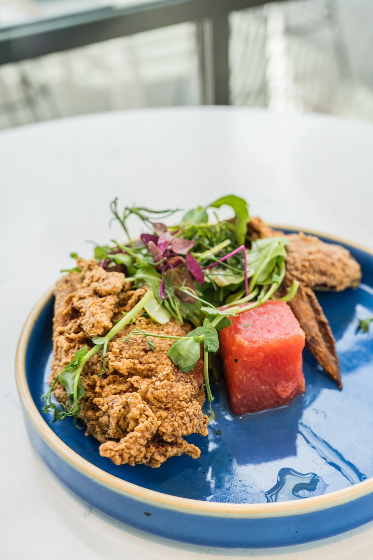 Fried chicken with compressed watermelon at Coco Maya happy hour