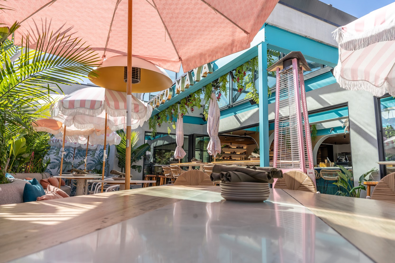The elevated rooftop patio and bar area at Coco Maya