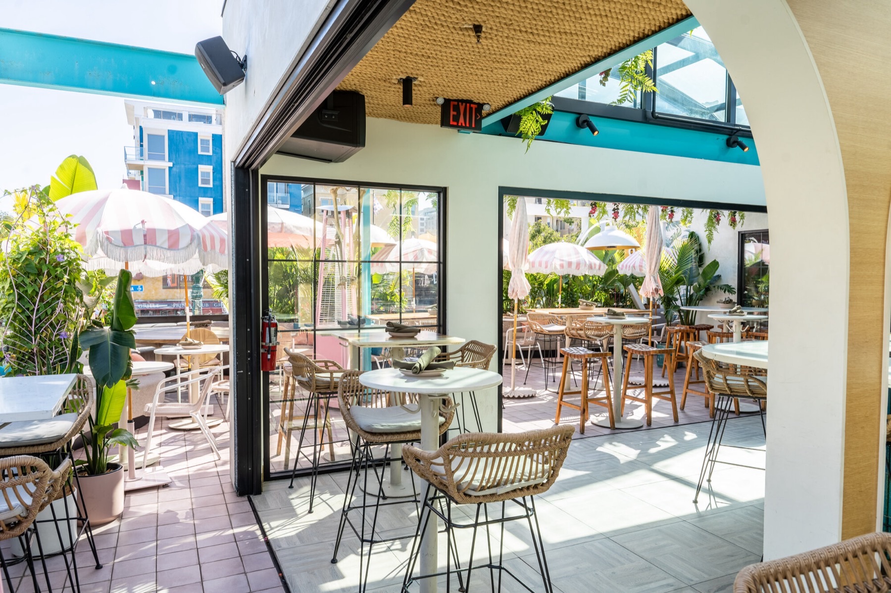 Coco Maya rooftop patio and glass atrium bar — Little Italy San Diego restaurant
